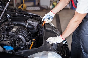 Mechanic changing oil